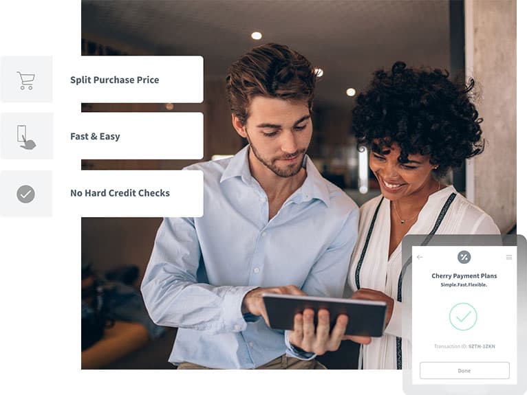 Man & Woman Looking in Tablet & Smiling | Parlour at the Village in Salado, TX